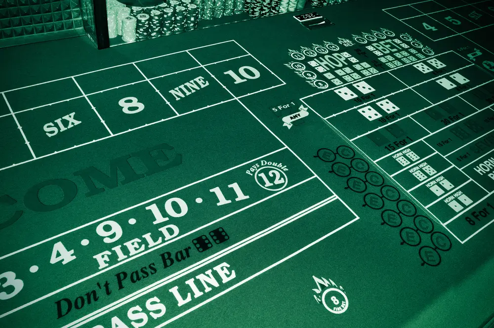 Craps table where you can place your chips and apply tips and strategies.